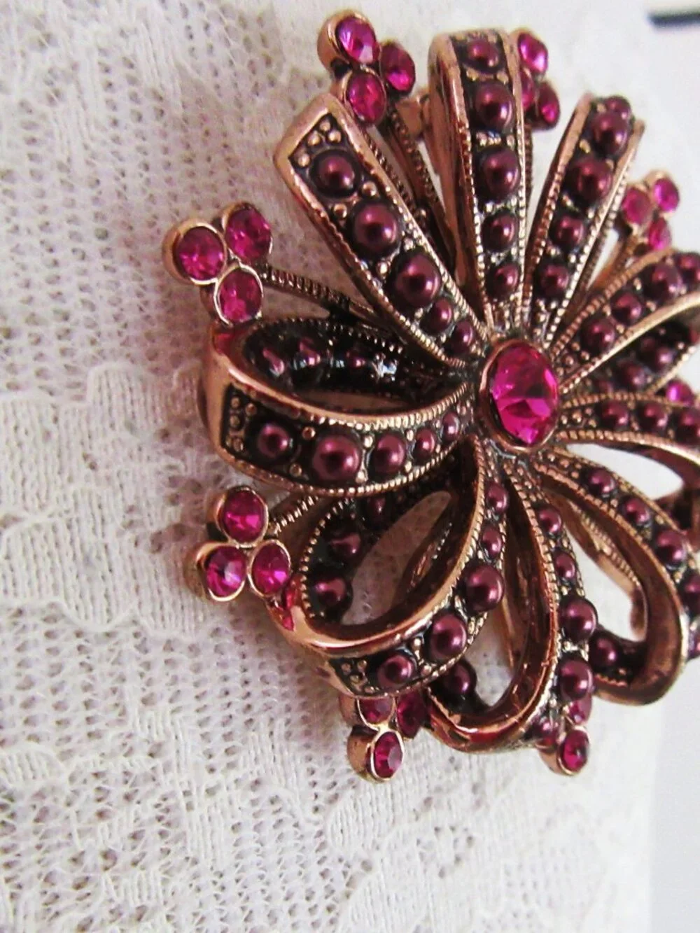 Liz Claiborne copper ribbon brooch with red & pink rhinestones